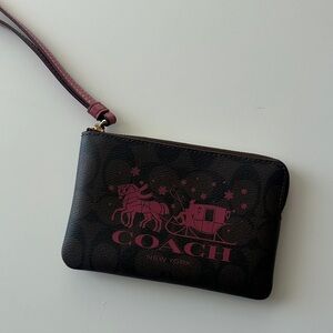 Coach Dark Brown Wristlet with Pink Font